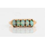 A five stone opal ring, set with five oval opal cabochons, stamped 375, ring size R, approx.