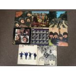 Eight Beatles vinyl records, Sgt Peppers, Abbey Road, Help!, Beatles For Sale, A Hard Days Night,
