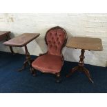 Two Victorian mahogany single column side tables with a nursing chair. IMPORTANT: Online viewing and