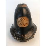 A Birmingham Police Institute black painted tin money box in the form of a police helmet, approx.