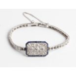 A sapphire and diamond bracelet, set with three principal round brilliant cut diamonds to central