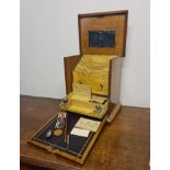 A Victorian mahogany writing box including two inkwells and items belonging to Henry Everton
