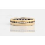 A hallmarked 18ct yellow and white gold diamond full eternity ring, set with round brilliant cut