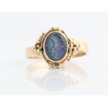 A hallmarked 9ct yellow gold synthetic opal doublet ring, ring size P½, approx. weight 3.7g.