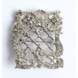 A paste set open metalwork brooch, unmarked white metal. IMPORTANT: Online viewing and bidding only.