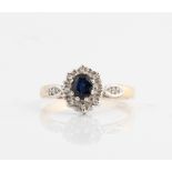 A hallmarked 9ct yellow gold sapphire and diamond cluster ring, ring size N, approx. weight 2g.