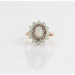 A hallmarked 9ct yellow gold opal and diamond cluster ring, ring size N, approx. weight 3.7g.
