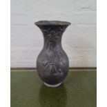 A lead floral design vase, height 35cm, very heavy. IMPORTANT: Online viewing and bidding only.