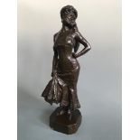 A bronze sculpture signed R Lancelot Croce 906, female with cat on her shoulder, height 36cm.