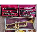 Two clarinets and a brass trumpet, all in cases. IMPORTANT: Online viewing and bidding only.