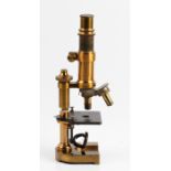 An E. Leitz Wetzlar No. 62023 brass microscope, inscribed Swift & Son 1/6 in to the lens, height