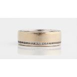 A diamond set wedding band, channel set with round brilliant cut diamonds to top of band and