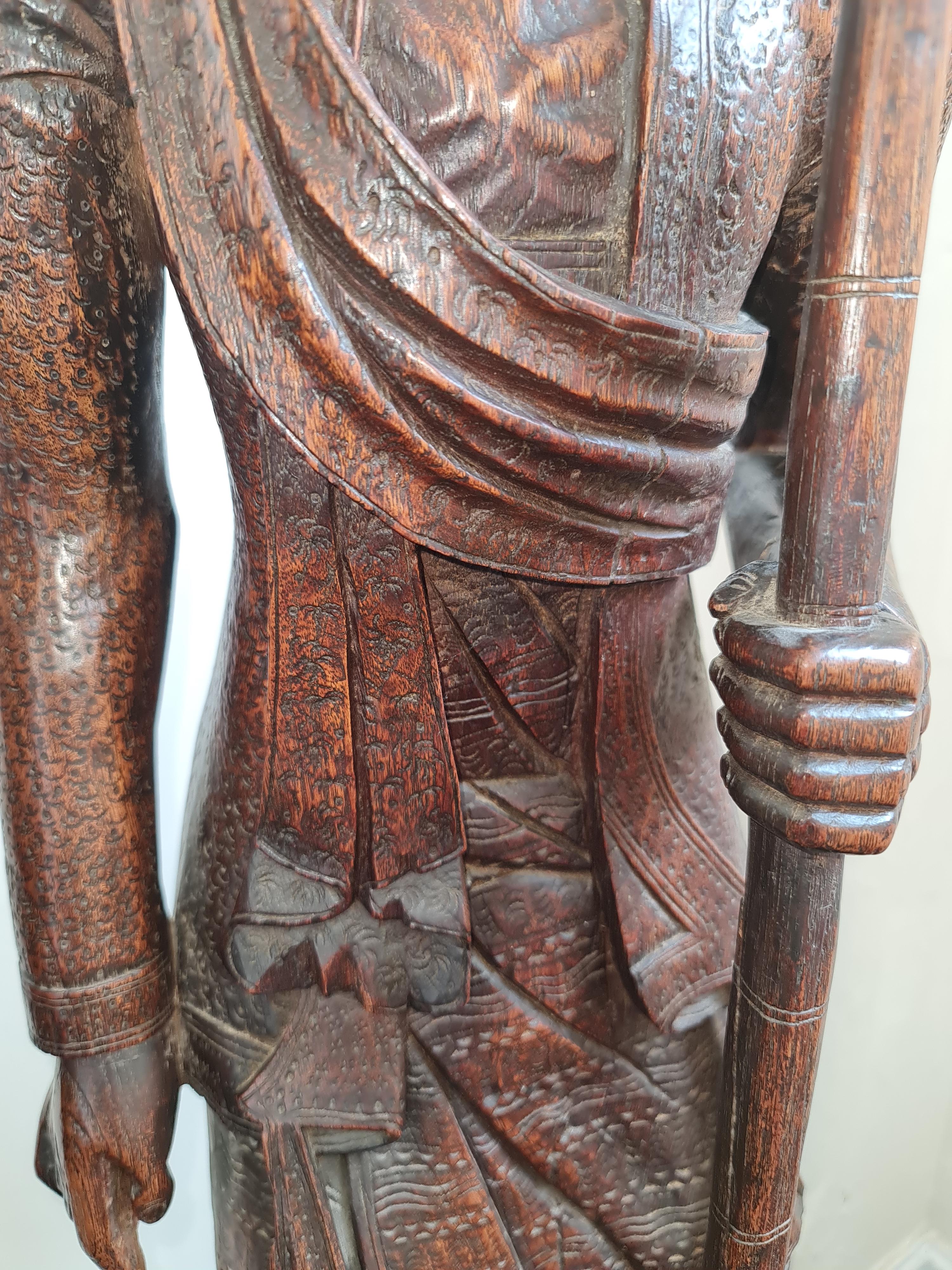 Two 19th century large oriental one piece carved wood male and female elderly traveller figures, - Image 5 of 6