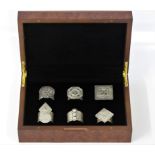 Six various patterned napkin rings based on traditional Omani rings, housed in fitted box from
