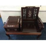 *A Chinese style hardwood telephone hall seat with carved pierced back and sides with mother of