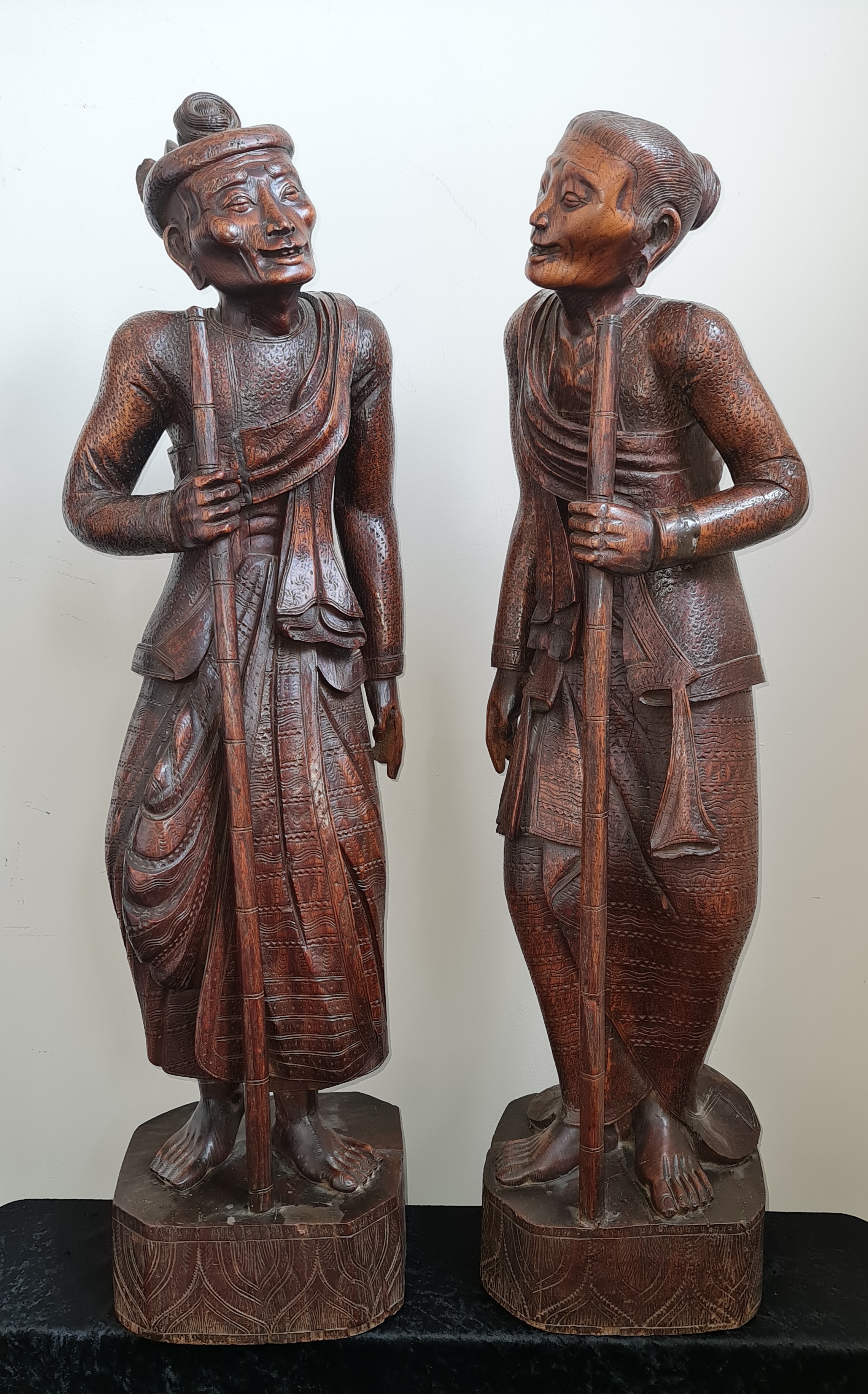 Two 19th century large oriental one piece carved wood male and female elderly traveller figures, - Image 6 of 6