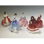 Five Royal Doulton figures, Christmas Time, Southern Belle, Blithe Morning, Rebecca and Lorraine.
