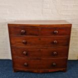 A mahogany Victorian bow fronted chest with three long and two short drawers. IMPORTANT: Online