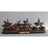 A handpainted metal figure group mounted on wood, ‘The Kings Troop, Royal Horse Artillery, Royal
