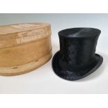 A black top hat with Royal crest 'Extra Quality' in cardboard hat box. IMPORTANT: Online viewing and