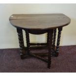 An 18th century oak small gate leg table on turned bobbin supports, height 64cm. IMPORTANT: Online