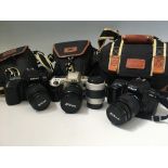 Three Nikon cameras, F50, F60 and F70, all in cases, with additional Nikon lens. IMPORTANT: Online