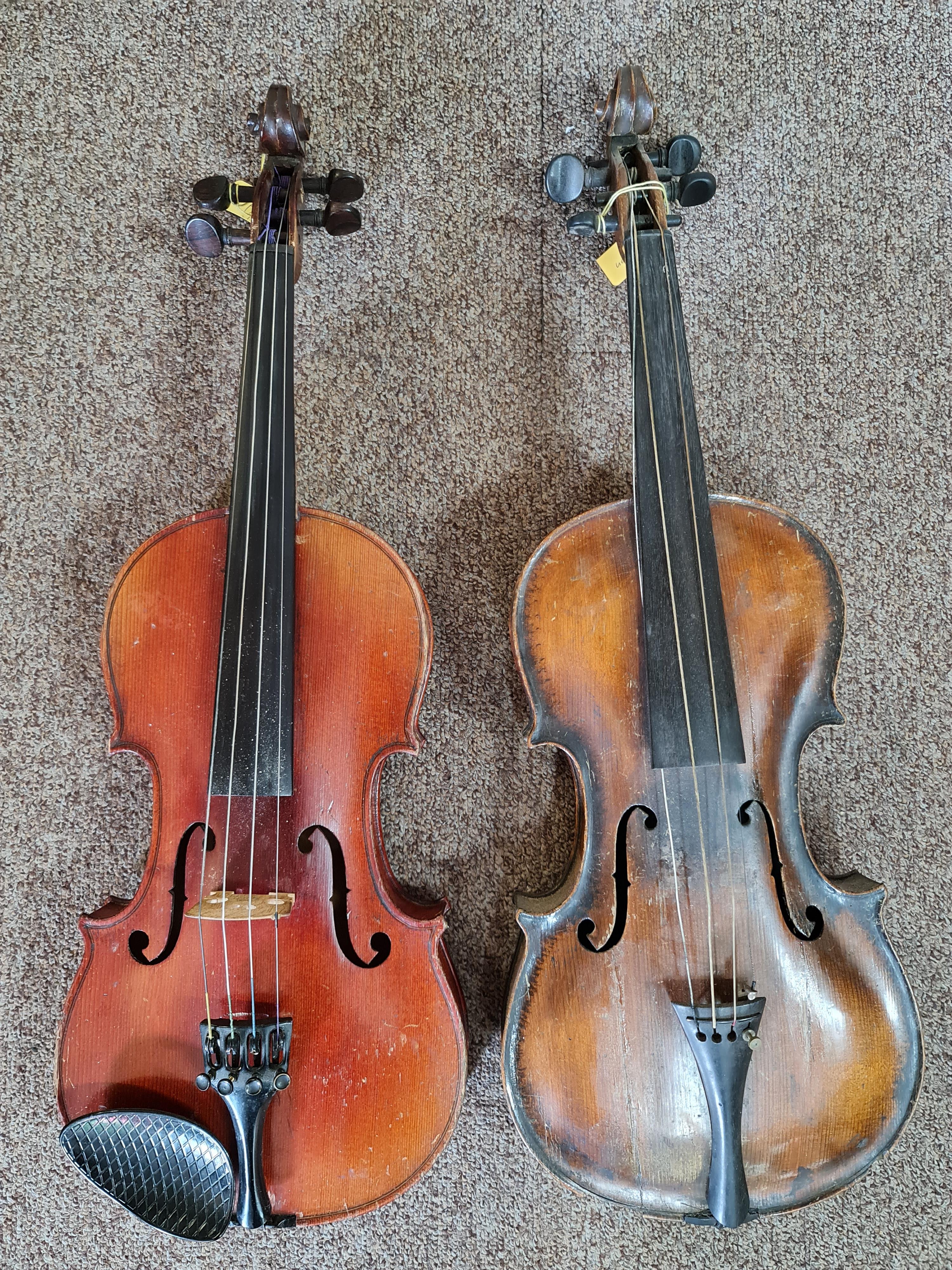 Two violins, one Stradivarius copy, one German, no cases. IMPORTANT: Online viewing and bidding