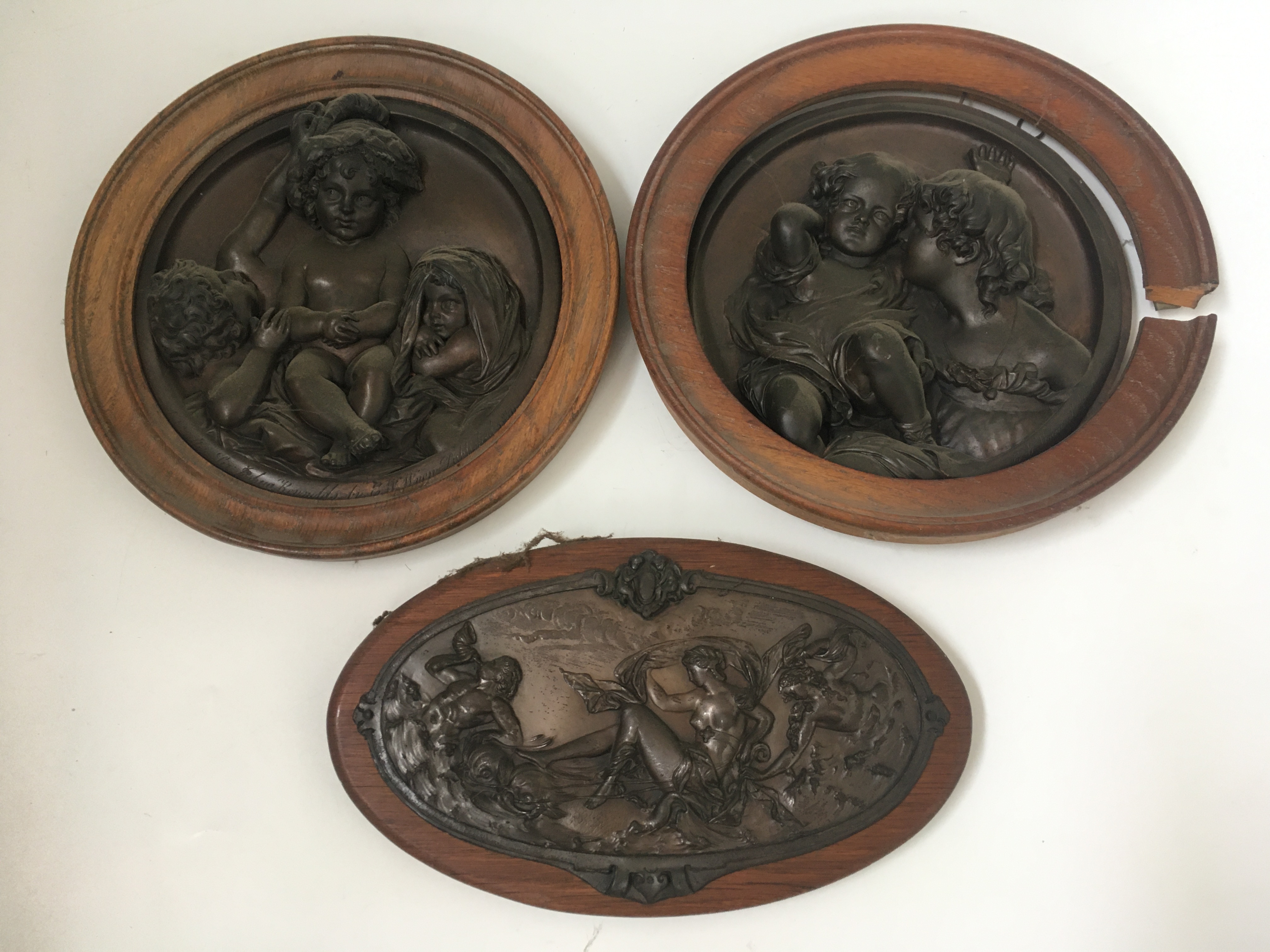 Two bronze wall plaques by E. W. Wyon, with one similar Grecian style bronze plaque. IMPORTANT: