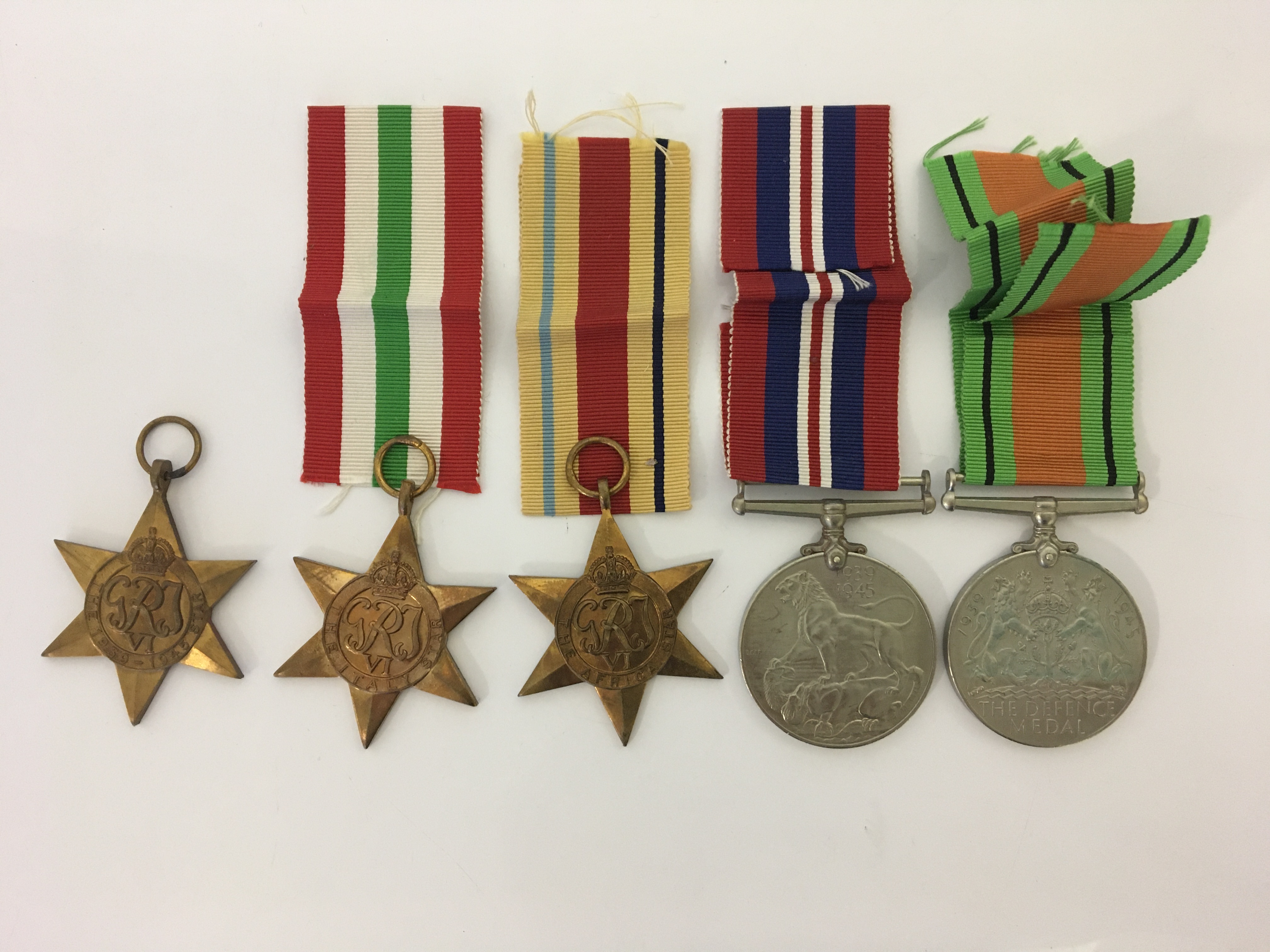 Five World War Two medals, War, Defence, with 1939-45, Africa and Italy stars. IMPORTANT: Online