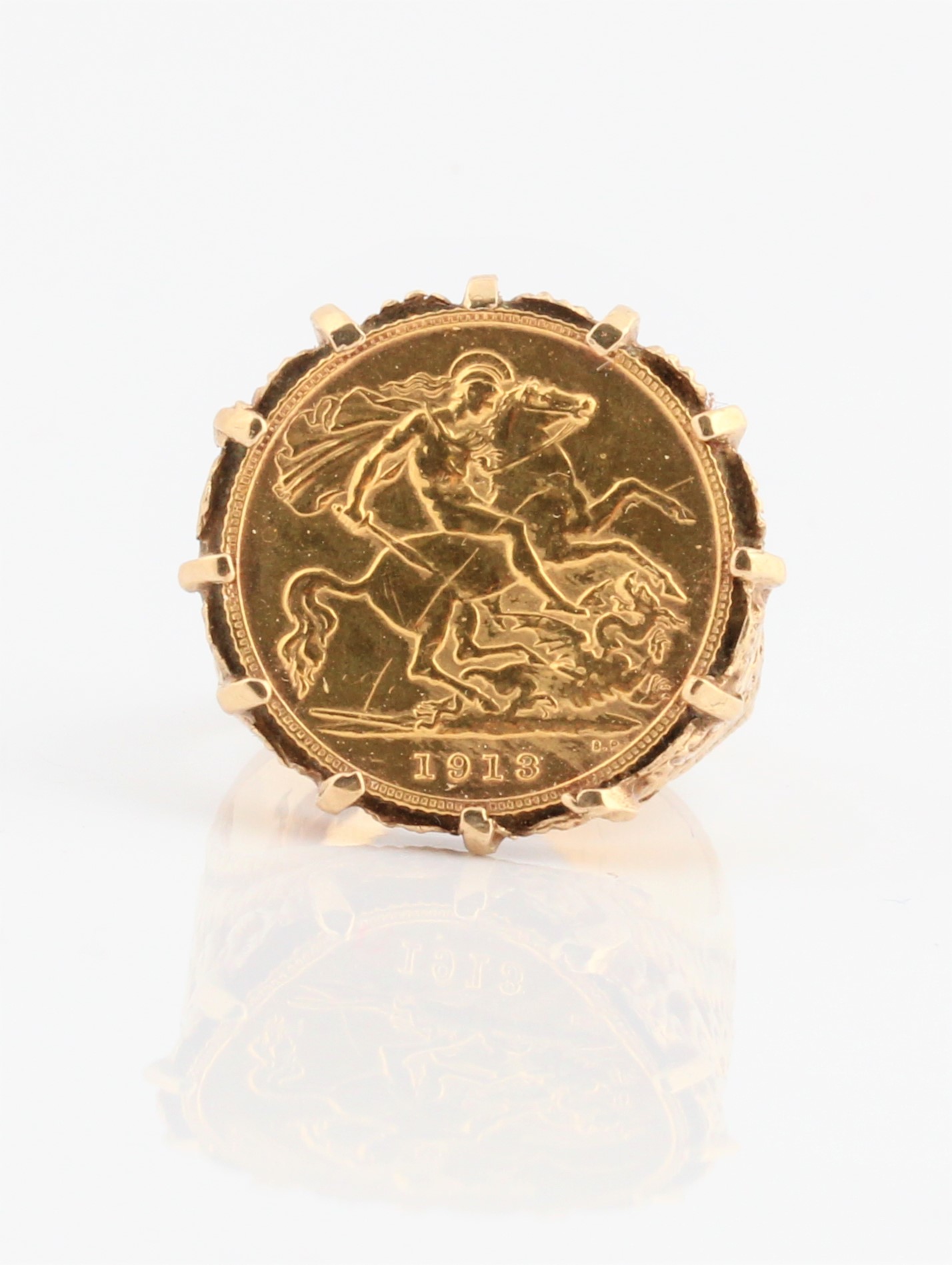 A George V 1913 half sovereign mounted in a hallmarked 9ct yellow gold ring mount, ring size R½,