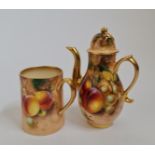 A Royal Worcester miniature teapot and teacup decorated with fruits, both signed. IMPORTANT: