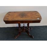 A late Victorian walnut flip top games table on turned column support. IMPORTANT: Online viewing and
