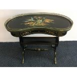 A lacquerware kidney shaped side table with brass pierced gallery to top and brass feet, painted