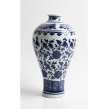 *A Chinese blue and white vase with floral design, with character marks to base Qing dynasty,