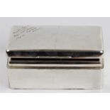 A silver rectangular cigarette box, lid having engraved inscription, with two compartments to