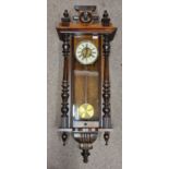 A walnut cased wall hanging Vienna style wall clock. IMPORTANT: Online viewing and bidding only.