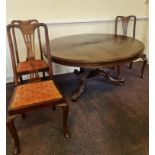 A mahogany Victorian round tilt topped dining table together with a set of four Queen Anne style