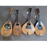 Four various mandolins and a Greek zither. IMPORTANT: Online viewing and bidding only. Collection by