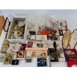 A large collection of costume jewellery, to include gem stone brooches, bead necklaces, crystal bead
