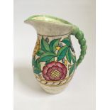 A Crown Ducal 4040 Persian Rose pattern jug, approx. Height 21cm. IMPORTANT: Online viewing and