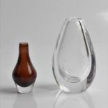 Two Kosta Sweden glass vases, one designed by Elis Bergh etched with floral design, marked to base