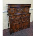 An oak reproduction court cupboard with carved front panels. IMPORTANT: Online viewing and bidding