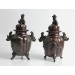 Two Chinese bronze sensors decorated with foo dogs to top and sides, birds on branches to body, on