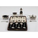 Twelve hallmarked silver coffee bean spoons, together with a silver rimmed tortoise shell lid and