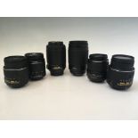 Six Nikon camera lenses, including 70-300mm 1:4-5.6 G and 55-200mm 1:4-5.6 G (with box).