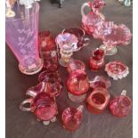 Seventeen pieces of various cranberry glass, including vases, jugs, dishes. IMPORTANT: Online