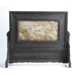 A Chinese screen with marble panel to centre framed by carved wooden border on carved wooden