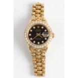 A ladies Rolex Oyster Perpetual Date Just wrist watch, the black dial having hourly diamond set