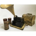 A Thomas Edison Gem Phonograph with approx. 16 wax cylinders. IMPORTANT: Online viewing and