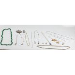 A collection of costume jewellery to include brooches, earrings, pendants on chains, beads, rings